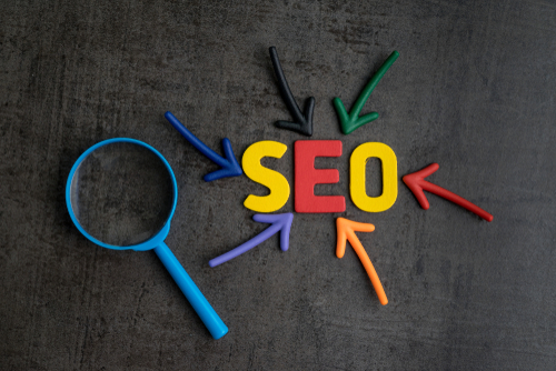 The word SEO in different colors with arrows pointing to each letter
