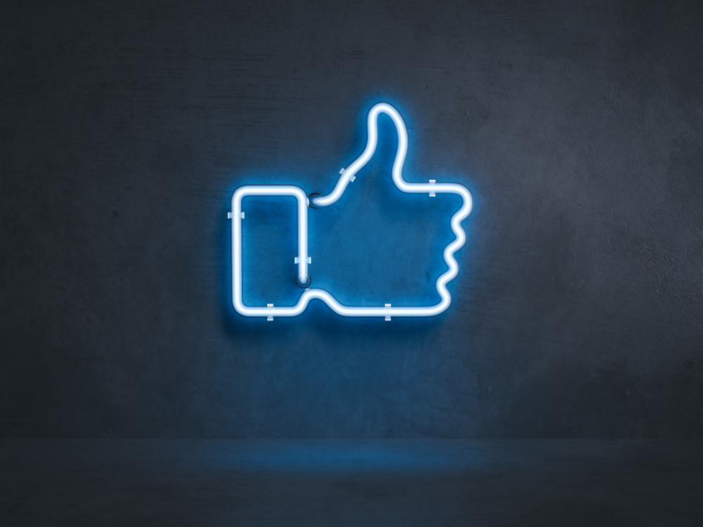 neon blue facebook thumbs up sign
